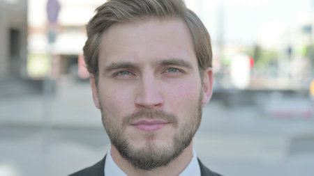 Close Up of Businessman Looking at the Camera Outdoorの写真素材