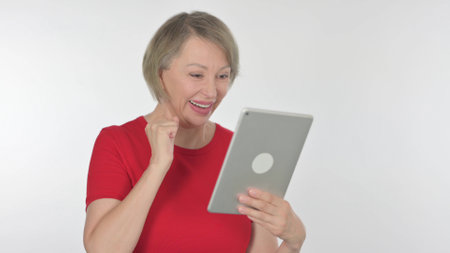 Old Woman Celebrating Success on Tablet on White Background
