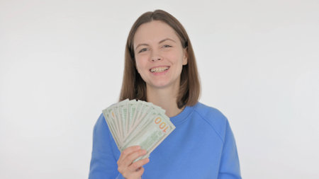 Casual Woman Showing Dollars on White Backgroundの写真素材