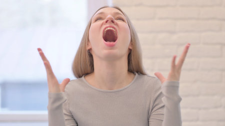 Portrait of Angry Creative Young Woman Shouting and Fighting