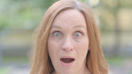 Face Close up of Shocked Woman Outdoorの写真素材