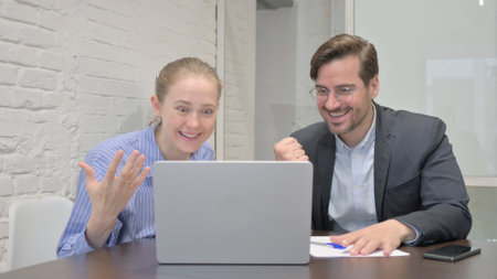 Business People Celebrating Success in Office