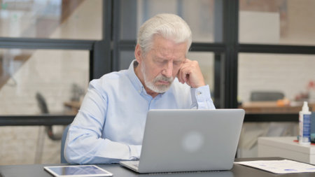 Old Businessman Working in Office