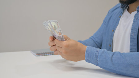 Close up of Hands Counting Money