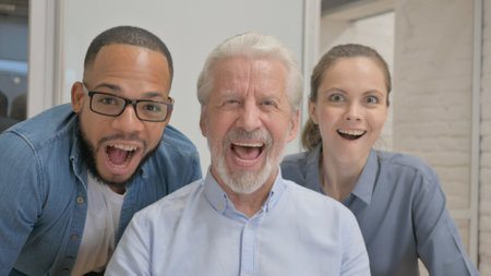 Portrait of Excited People Cheering in Office