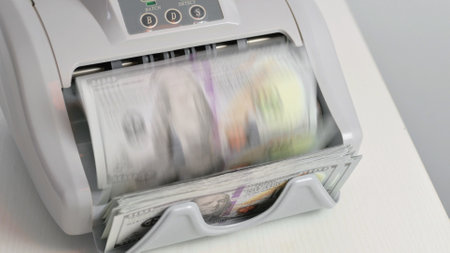 Counting Money in the Officeの写真素材