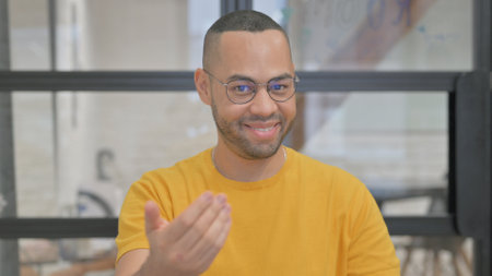 Portrait of Confident Mixed Race Man inviting People