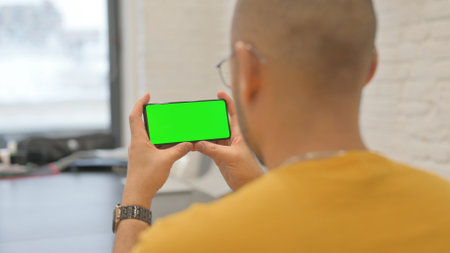 Holding Phone Horizontal with Green Screen