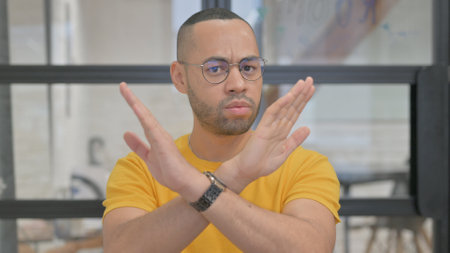 Portrait of Tense Mixed Race Man in Denial