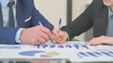 Close up of Hands Doing Paperwork in Officeの写真素材