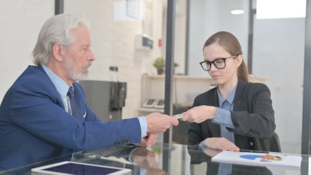 Business People Exchange Money and Home Keysの写真素材