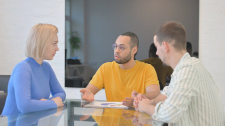 Mixed Race Man Talking with Multi Ethnic Team