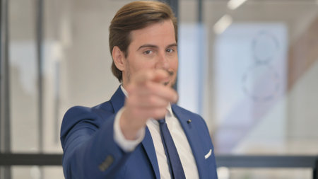 Portrait of Young Businessman inviting Peopleの写真素材