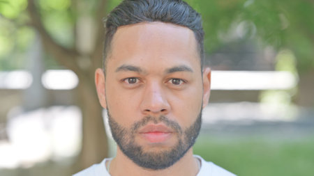Outdoor Close up of Serious Young Man Face