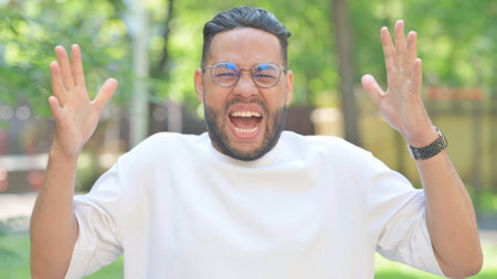 Screaming Man Outdoor in Parkの写真素材