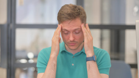 Portrait of Mature Adult Man with Migraineの写真素材