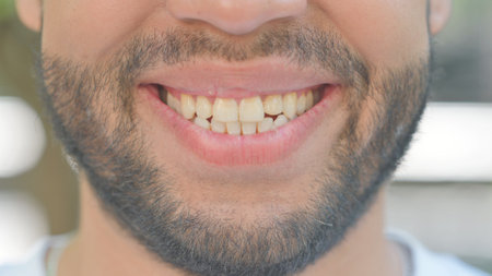 Outdoor Close up of Smiling Lips of Young Manの写真素材