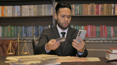 Hispanic Judge Facing Online Banking Problem in Courtroomの写真素材