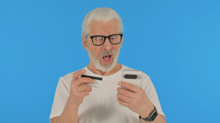 Casual Old Man Facing Shopping Failure on Green Backgroundの写真素材