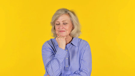 Sleeping Old Woman on Yellow Background, Portrait