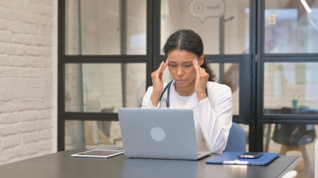 African Female Doctor Talking with Patient Online