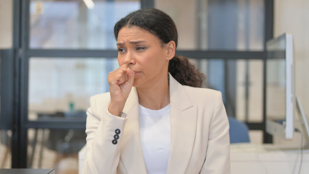 Portrait of Coughing Sick African Woman in Office