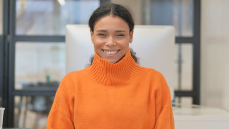 Portrait of Casual African Woman Pointing at Camera