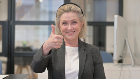 Portrait of Senior Old Business Woman with Thumbs up