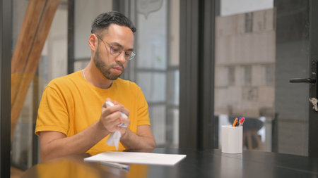 Creative Mixed Race Man Writing a Letter at Work