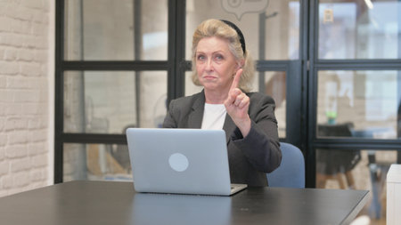 Senior Old Business Woman in Denial Using Laptopの写真素材