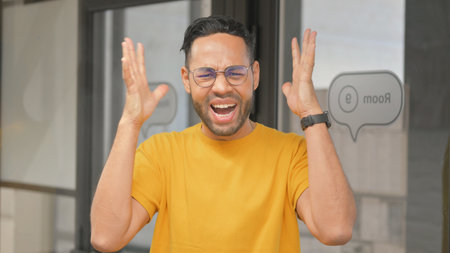 Portrait of Casual Young African Man Going Crazyの写真素材