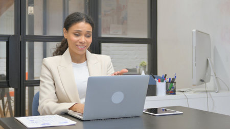 African Business Woman Doing Video Chat via Laptopの写真素材