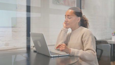 Multiracial Woman Working on Laptop