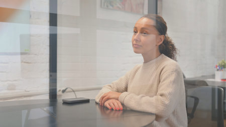 Pensive Multiracial Woman Brainstorming New Idea at Workの写真素材