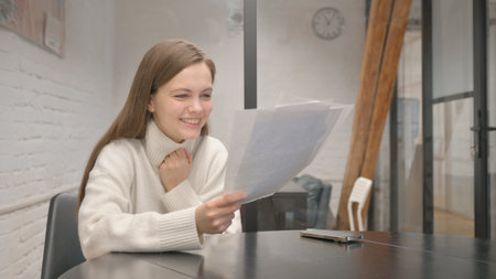 Excited Young Woman Celebrating New Report