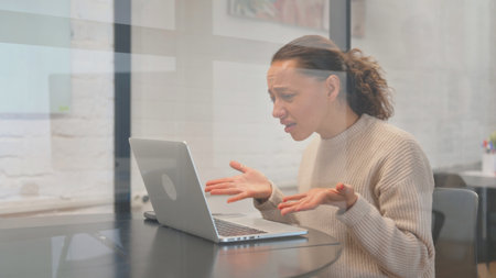 Multiracial Woman Feeling Angry and Tense at Workspace