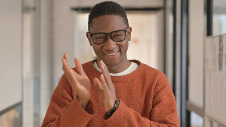 Portrait of Hispanic Woman Clapping for Team