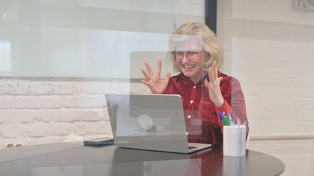 Senior Woman Feeling Angry and Tense at Workspace