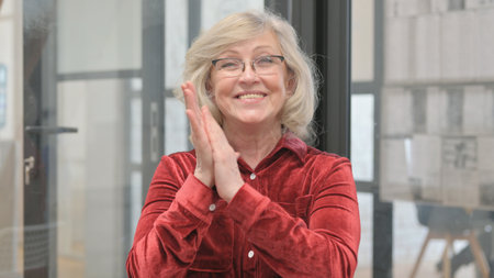 Portrait of Woman Clapping for Team