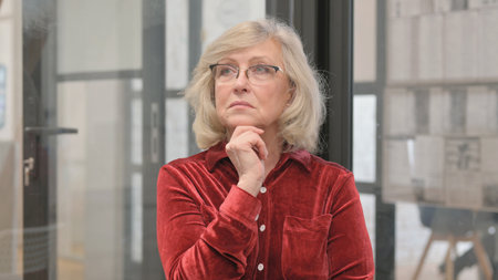 Portrait of Brainstorming Senior Old Woman with New Idea
