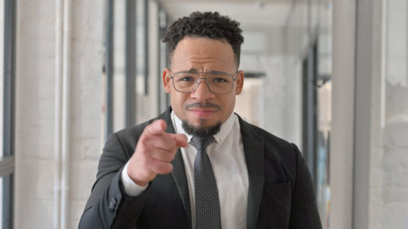 Portrait of Unsatisfied Hispanic Businessman Fighting in Argumentの写真素材