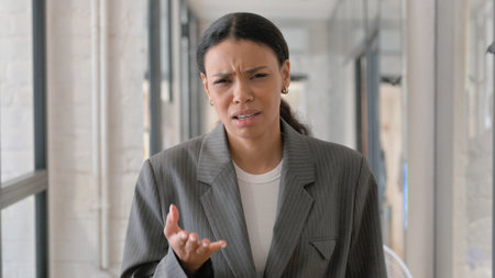Portrait of Shocked African Businesswoman Upset for Lossの写真素材