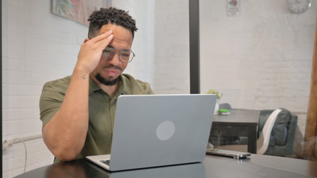 Mature Adult Hispanic Man having Headache atの写真素材