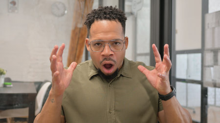 Portrait of Shocked Mature Adult Hispanic Man