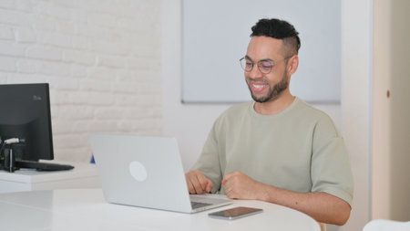 Hispanic Man Celebrating Online Success