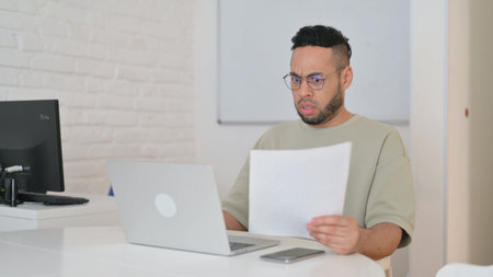 Hispanic Man Cursing Annual Business Report