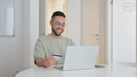 Online Banking by Middle Aged Man with Laptopの写真素材