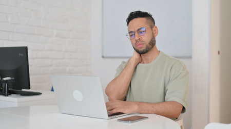 Hispanic Man with Back Pain at Work
