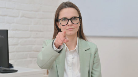 Portrait of Business Woman with Pointing Gestureの写真素材