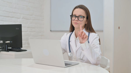 Writing Young Doctor Working on Medical Reportの写真素材